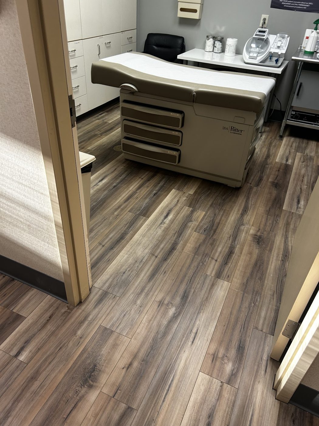 Warm luxury vinyl plank in a dental office treatment area