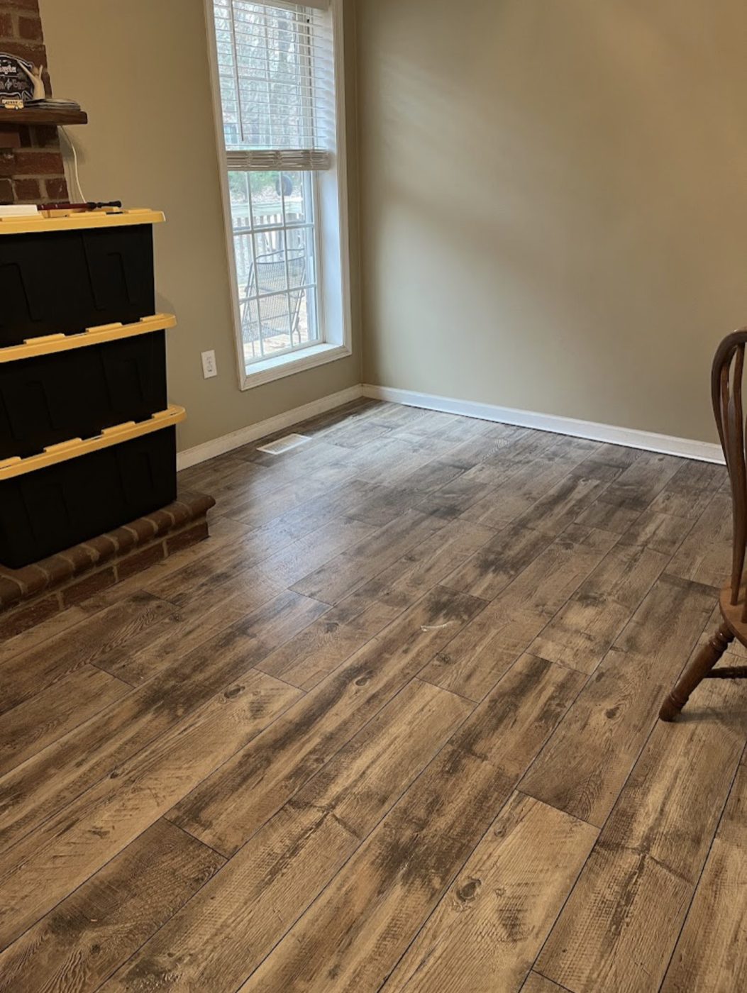 Rustic wood-look luxury vinyl plank in a living room
