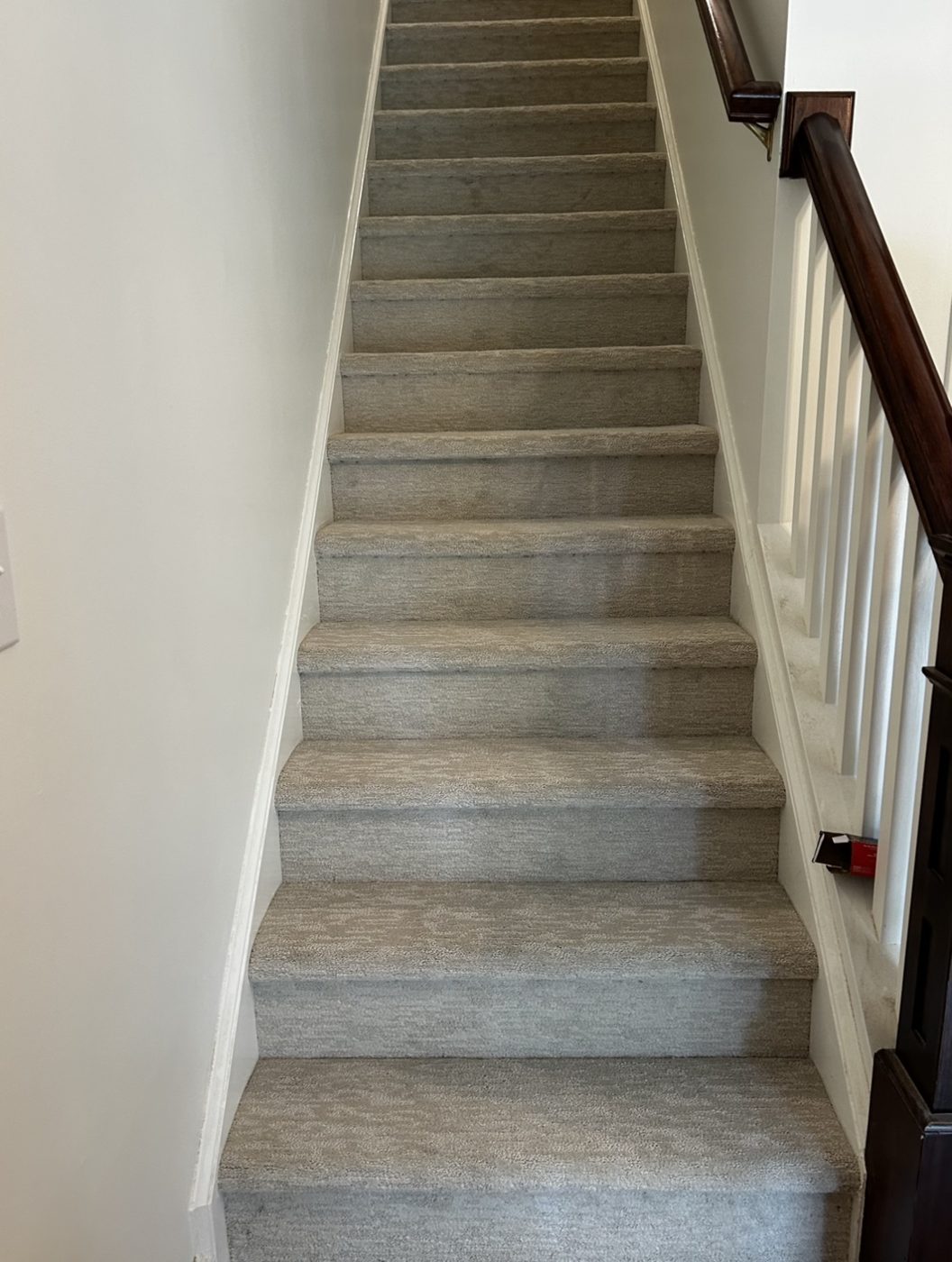 Staircase finished with soft textured neutral carpet